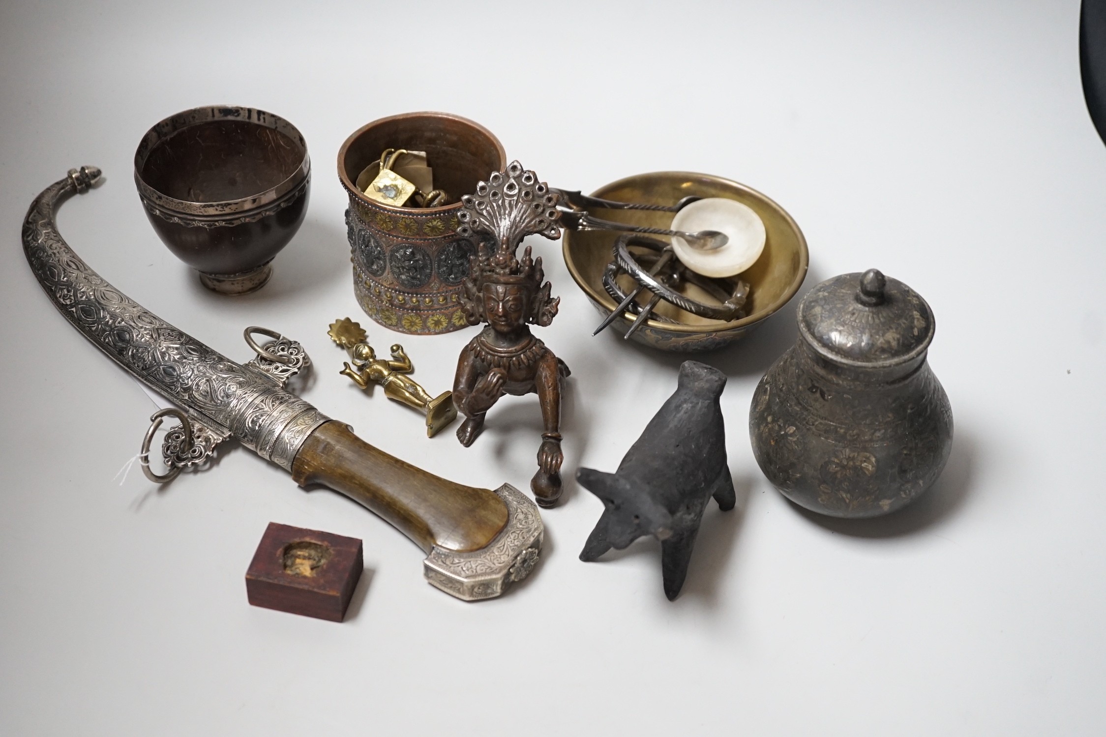 An Eastern white metal mounted dagger, a quantity of Eastern metalware and a white metal-mounted cup